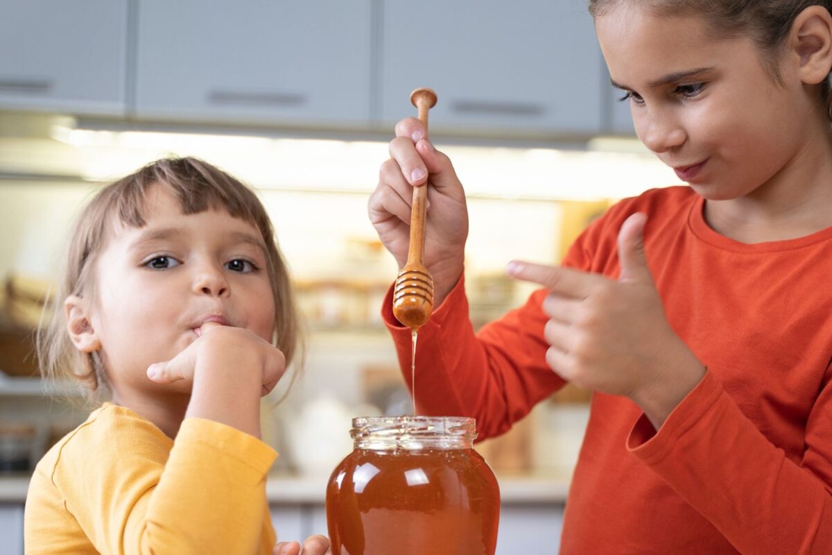 Girls eating Manuka honey